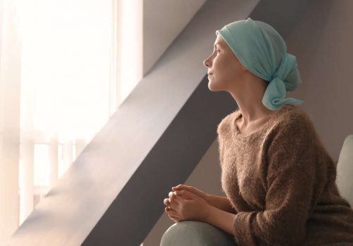 Young,Woman,With,Cancer,In,Headscarf,Indoors